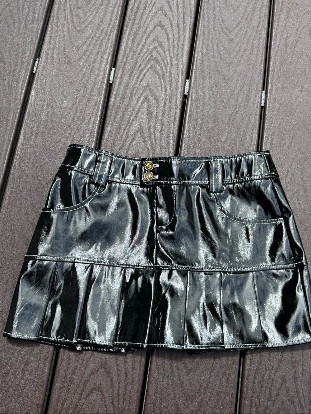 High-Shine Black Faux Leather Mini Skirt with Pleated Hem